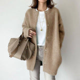 Oversized beige wool cardigan for women in khaki, featuring long sleeves and a relaxed fit, ideal for winter fashion.