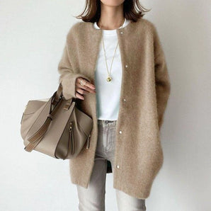 Oversized beige wool cardigan for women in khaki, featuring long sleeves and a relaxed fit, ideal for winter fashion.