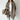 
Woman wearing an oversized beige wool cardigan, styled in a winter fashion. The cardigan features a collar and long sleeves, providing a cozy and warm appearance. The color is a coffee shade and is available in XL size, offering a relaxed fit suitable for layering during colder months.