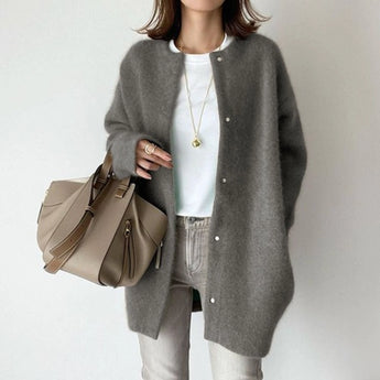 Cozy gray oversized wool cardigan for women, featuring long sleeves, a relaxed fit, and a warm collar, ideal for winter fashion.