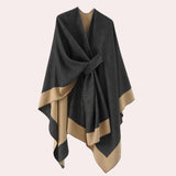 Oversized black designer poncho with an asymmetric cut, featuring a luxurious winter cape design in black and yellow in XL size.