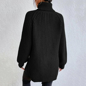 Oversized black ribbed knit turtleneck sweater with long sleeves, modeled on a person, showcasing the cozy and stylish winter fashion piece.