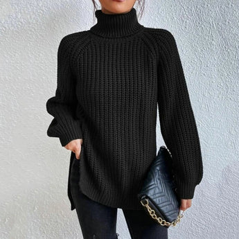 Oversized black ribbed knit turtleneck sweater in a cozy winter style, featuring long sleeves and a comfortable fit, ideal for cold weather fashion.