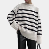 Oversized black and white chunky knit striped sweater, unisex crewneck, featuring long sleeves and a relaxed fit.
