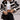 Oversized black and white shearling jacket featuring a plush texture, large collar, and long sleeves, styled for urban winter fashion in an XXL size.