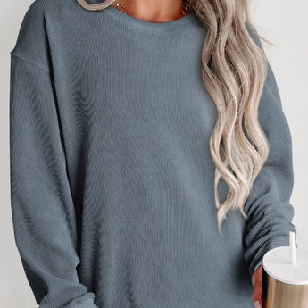 Oversized blue corduroy pullover for women, featuring long sleeves and a relaxed fit with a classic crew neck design.