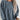 Oversized women's long sleeve pullover sweater in a blue corduroy fabric, featuring a relaxed fit with a drop shoulder design and ribbed cuffs.