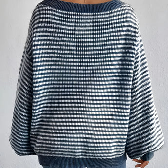 Oversized blue houndstooth chunky knit sweater for women's winter fashion, featuring long sleeves and a relaxed fit, with a focus on the azure and black pattern.