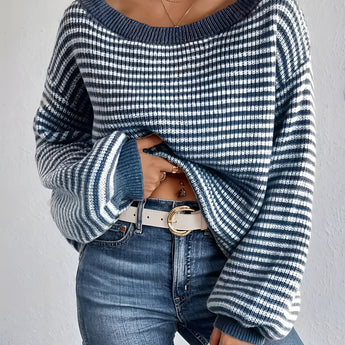 Oversized blue houndstooth chunky knit sweater for women, styled with jeans, highlighting the cozy and fashionable winter outerwear design.