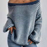 Oversized blue houndstooth chunky knit sweater for women, featuring a cozy and stylish winter fashion design with long sleeves and a relaxed fit.
