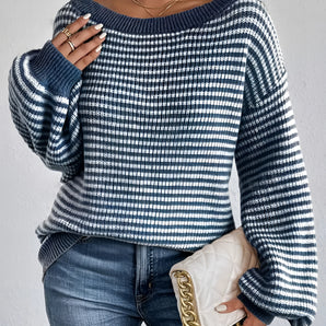 Oversized blue houndstooth chunky knit sweater for women, styled with jeans, highlighting the sweater's unique pattern and cozy texture, suitable for winter fashion.
