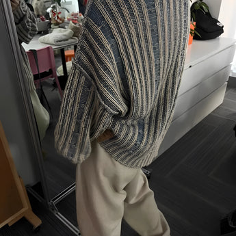 Oversized blue stripe knit sweater for women, featuring long sleeves and a comfortable fit ideal for autumn fashion.