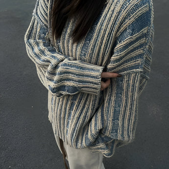 Oversized blue and grey striped knit sweater for women, featuring long sleeves and a relaxed fit, perfect for autumn fashion.