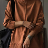 Oversized burnt orange women's crewneck sweater with a chunky knit pattern, featuring long sleeves and a relaxed fit.