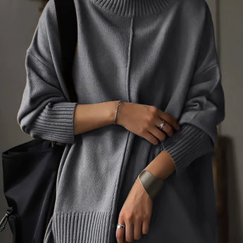 Oversized burnt orange women's crewneck sweater in chunky knitwear, featuring long sleeves and a relaxed fit.