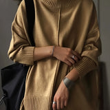 Oversized burnt orange women's crewneck sweater in chunky knitwear, featuring a cozy fit and long sleeves, perfect for stylish layering in cooler weather.