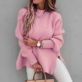 Oversized pink chunky knit turtleneck sweater in 3XL size worn by a woman, showcasing the sleeves, shoulder, and neck area. The sweater is part of women's winter fashion, emphasizing a cozy and stylish design.