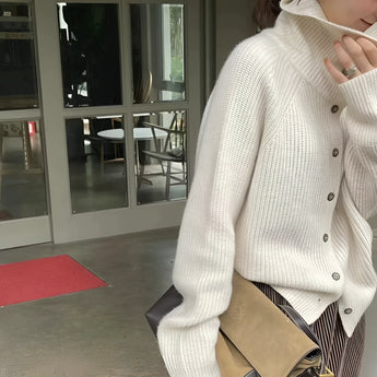Oversized chunky knit women's brown wool turtleneck sweater featuring long sleeves and a cozy high collar.