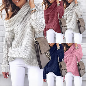 Oversized cowl neck knit sweater in a chunky and cozy design, perfect for fall fashion. The sweater is shown on a person, highlighting the outerwear style with a focus on the shoulder and arm area, against a plain white background.