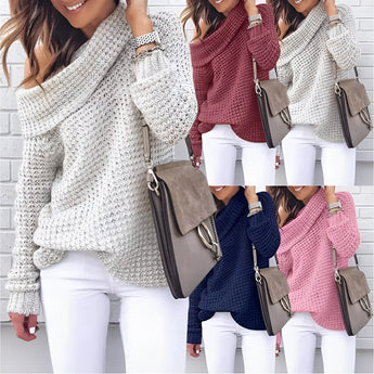 Oversized cowl neck knit sweater in a chunky and cozy design, perfect for fall fashion. The sweater is shown on a person, highlighting the outerwear style with a focus on the shoulder and arm area, against a plain white background.