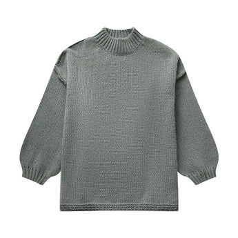Oversized cream knit sweater with a green hue, featuring long sleeves and a textured woolen pattern, ideal for elegant autumn fashion.