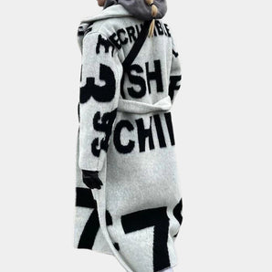 Oversized graphic streetwear hoodie with long sleeves, featuring a bold urban design and cozy fabric suitable for casual fashion.