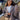 Oversized gray blazer paired with a cropped top and trousers, showcasing a chic streetwear outfit. The blazer features a relaxed fit with prominent sleeves and a notched collar, complementing the fashionable and comfortable ensemble.