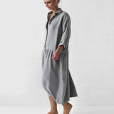 Oversized gray shirt dress with pockets, long sleeves, and a casual chic maxi style, worn by a model with sunglasses, featuring a collar and knee-length hemline in XL size.