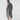 Oversized gray shirt dress with long sleeves and pockets, casual chic maxi style, size 2XL, modeled full-length showing legs and knees.