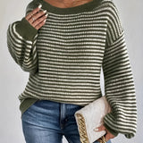 Oversized green striped knit sweater with a cozy boat neck pullover design, featuring long sleeves and a relaxed fit.