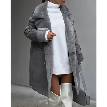 Oversized grey faux fur coat with long sleeves and a cozy chic winter design, featuring a soft texture and stylish fit.