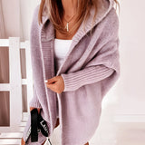 Oversized grey hoodie dress in a cozy knit fabric with pockets, featuring long sleeves and a relaxed fit, styled in a purple color variant in size XL.