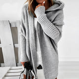 
An oversized grey hoodie dress in a cozy knit fabric featuring long sleeves, a hooded neckline, and convenient pockets, shown in an XL size.