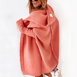 Oversized grey hoodie dress made from cozy knit fabric, featuring a relaxed fit with sleeves and convenient pockets, showcased in an orange color, size XL.