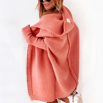 Oversized grey hoodie dress made from cozy knit fabric, featuring a relaxed fit with sleeves and convenient pockets, showcased in an orange color, size XL.