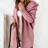Oversized rose-colored hoodie dress in XL, featuring cozy knit fabric with long sleeves, a comfortable hood, and convenient pockets.