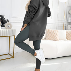 Oversized grey hoodie and leggings set with a trendy urban streetwear style, featuring long sleeves and a comfortable fit, shown in a casual pose.