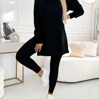 Oversized grey hoodie and leggings set displayed on a model, showcasing trendy urban streetwear style in a black color variant, size 3XL. The outfit features a comfortable fit with emphasis on the shoulders, neck, waist, knees, and sleeves.