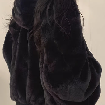 Oversized grey puffer jacket for women in a Nero color, size XL, featuring a high neck and long sleeves, designed for fashionable winter wear.