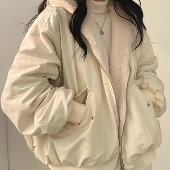 Oversized beige puffer jacket for women, featuring a fashionable winter coat design with a high collar, long sleeves, and a tailored waist, shown in an XL size.