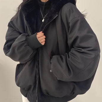 Oversized grey puffer jacket for women featuring a stylish collar and long sleeves, perfect for winter fashion.