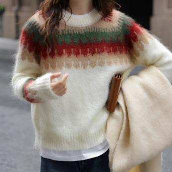Oversized plaid wool scarf with fringe wrapped around a woman's neck, complementing her winter outerwear in an urban chic style.