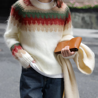 Oversized plaid wool scarf with fringe draped over a person's shoulders, showcasing its urban chic style. The scarf is worn with fashionable outerwear, highlighting its cozy and stylish appeal for winter.