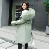 Luxurious oversized green fur hooded coat with long sleeves, designed for winter fashion, shown in a 4XL size.