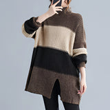 Oversized striped turtleneck sweater dress with chunky knit design, showcasing long sleeves and a relaxed fit suitable for winter fashion.