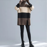 Oversized turtleneck striped sweater dress with chunky knit design, featuring long sleeves and a high collar, suitable for winter fashion.