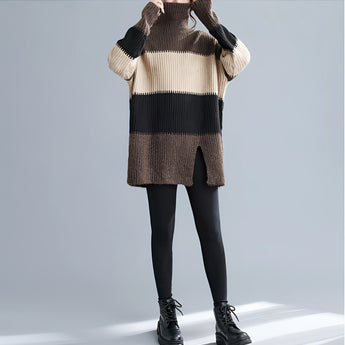 Oversized turtleneck striped sweater dress with chunky knit design, featuring long sleeves and a high collar, suitable for winter fashion.
