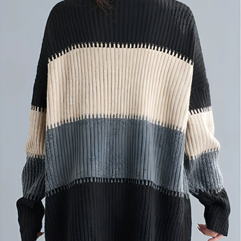 Oversized turtleneck striped sweater dress in chunky knit fabric featuring black and white stripes, showcasing winter fashion style.