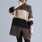 Oversized grey turtleneck striped sweater dress with chunky knit design, featuring long sleeves, covering shoulders and extending to the thighs.