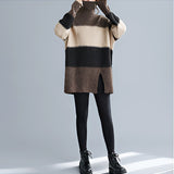 
A woman wearing an oversized turtleneck striped sweater dress made of chunky knit, suitable for winter fashion. The dress has long sleeves and extends to her thighs. The image focuses on the upper body, showing the detailed knit texture and striped pattern of the sweater dress.
